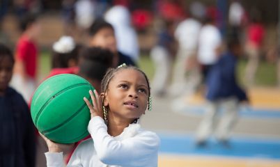 girl throwing basketball