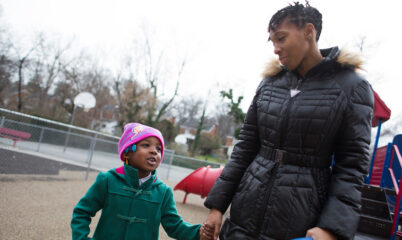 woman and child on playground