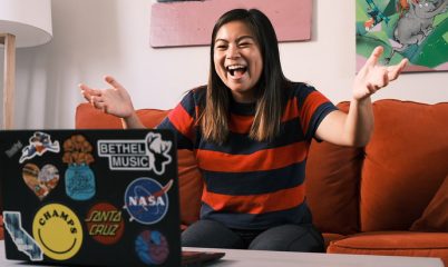 woman smiling at laptop