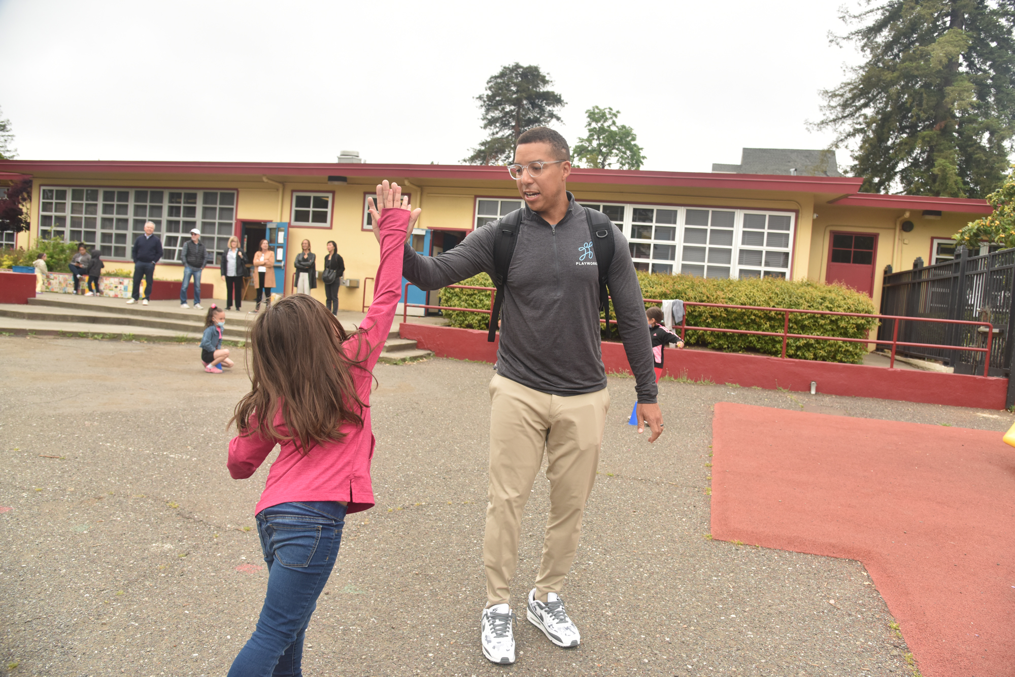 adult high-fiving child