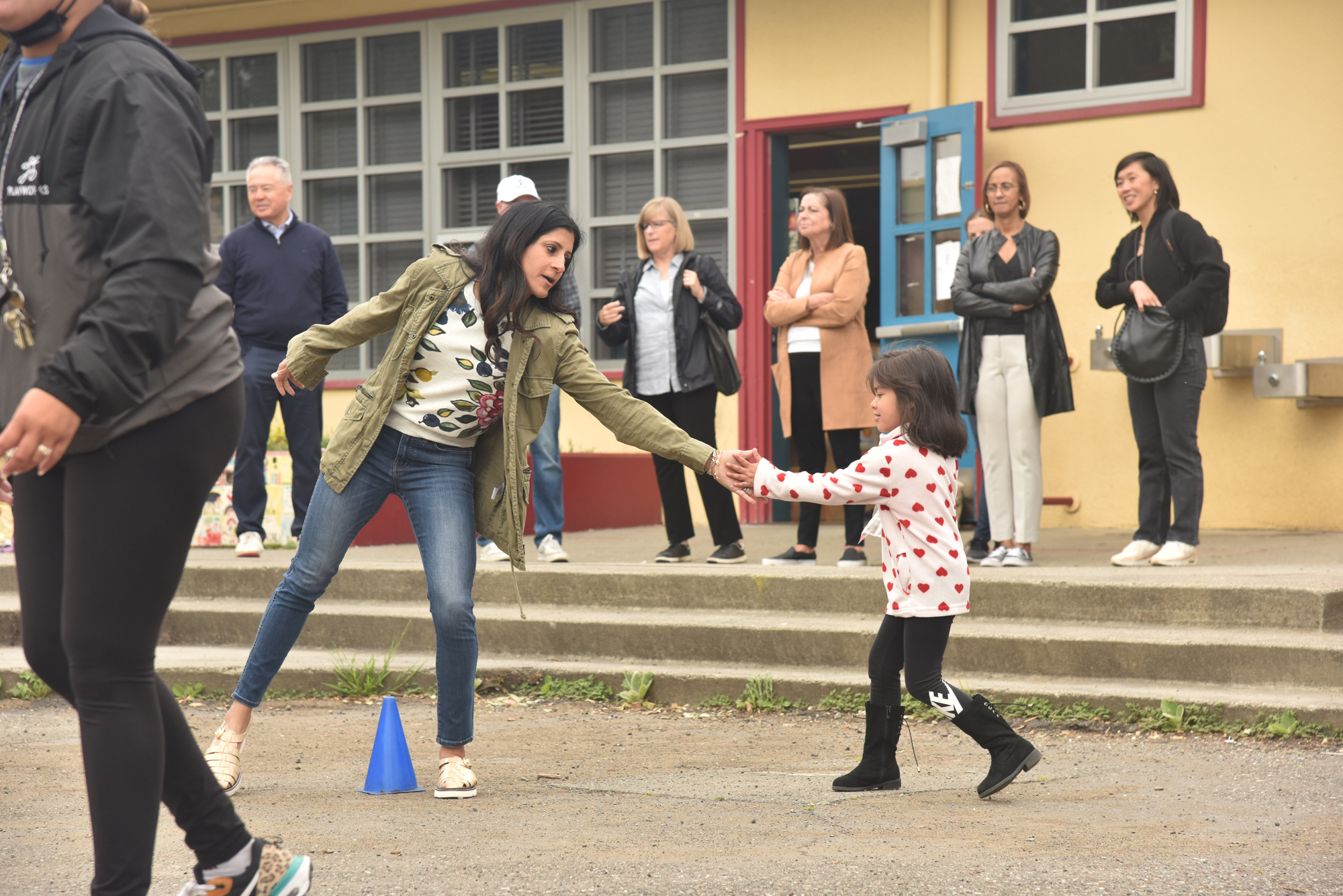 adult high-fiving student