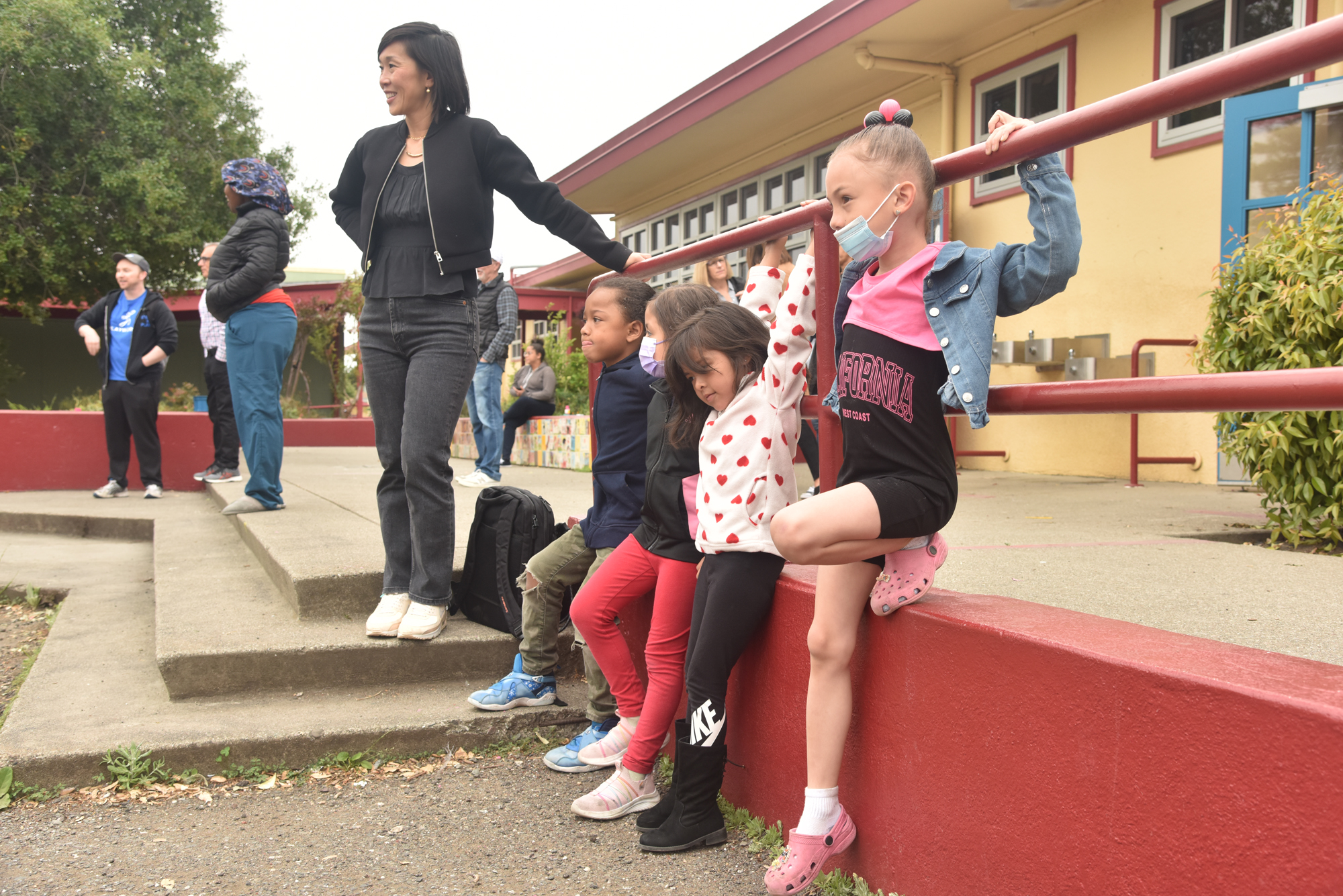 adult and kids on playground