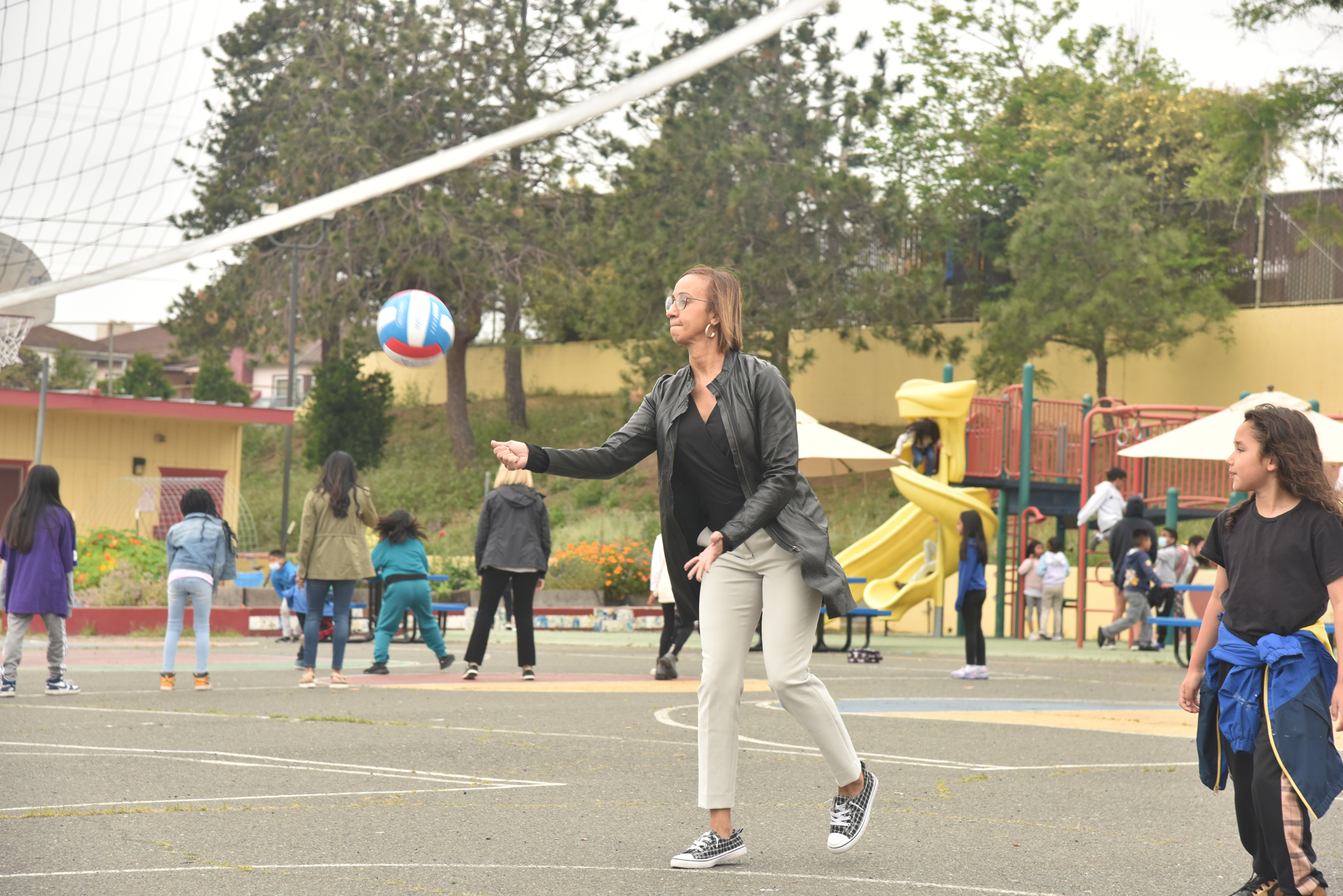 adult playing volleyball