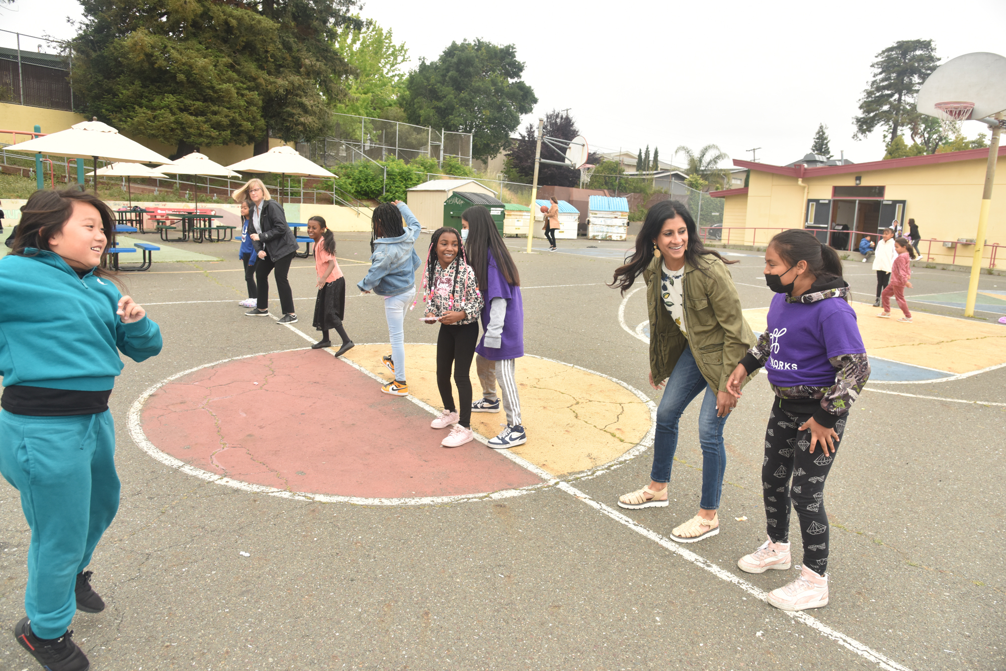 adult and kids playing on playground