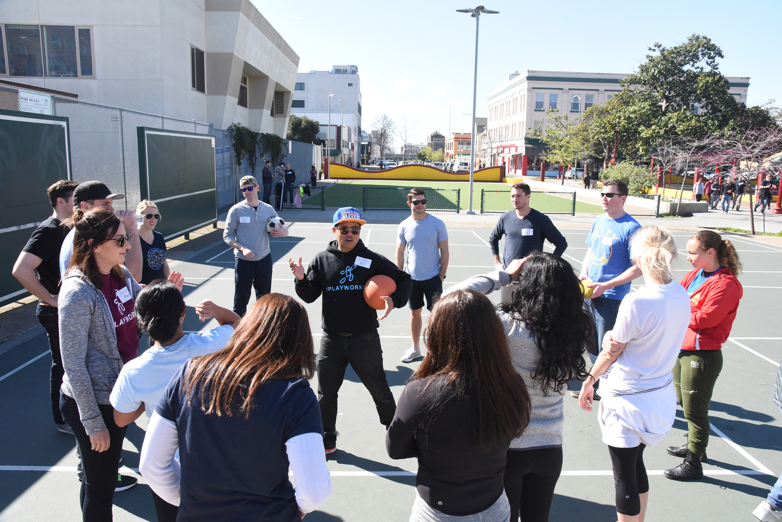 adults in a circle on the playground