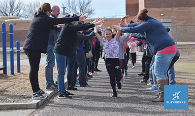 kids running through high five line