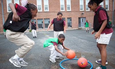 Children playing recess games like Sneak