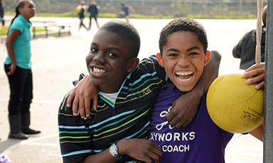 two boys smiling on playground